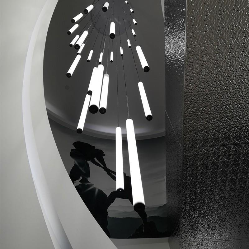 Spiral multi-light chandelier hanging in a stairwell foyer, view 5
