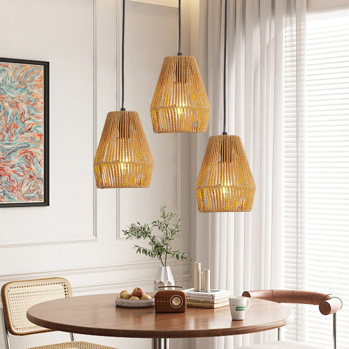 Set of three woven hemp rope pendant lights over a table, view 9