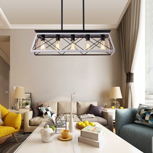White and black five-light farmhouse chandelier over a dining table