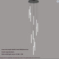 Spiral multi-light chandelier hanging in a stairwell foyer, view 9