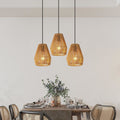 Set of three woven hemp rope pendant lights over a table