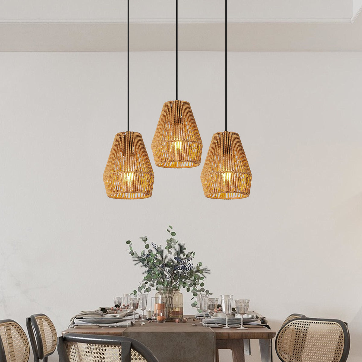 Set of three woven hemp rope pendant lights over a table
