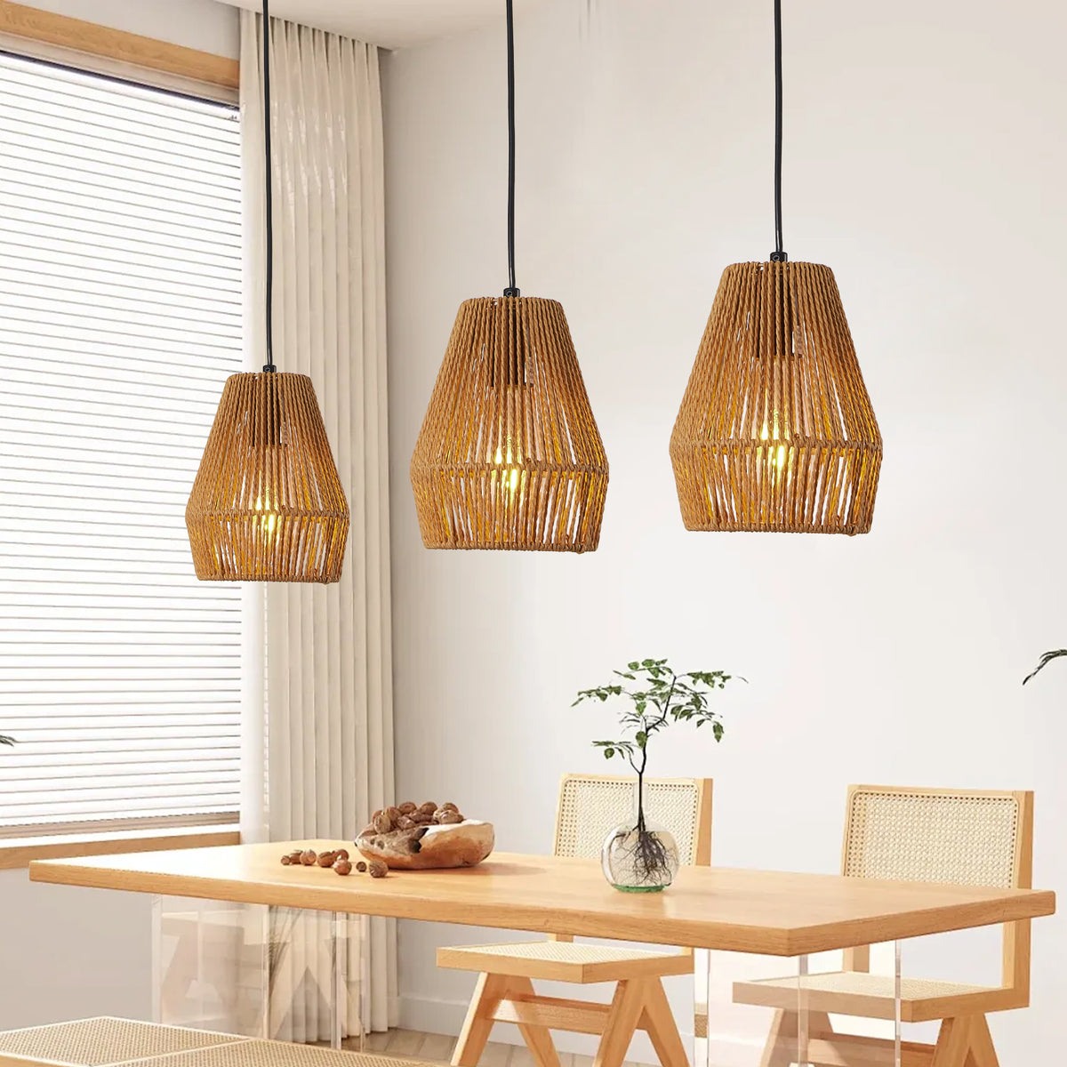 Set of three woven hemp rope pendant lights over a table, view 8