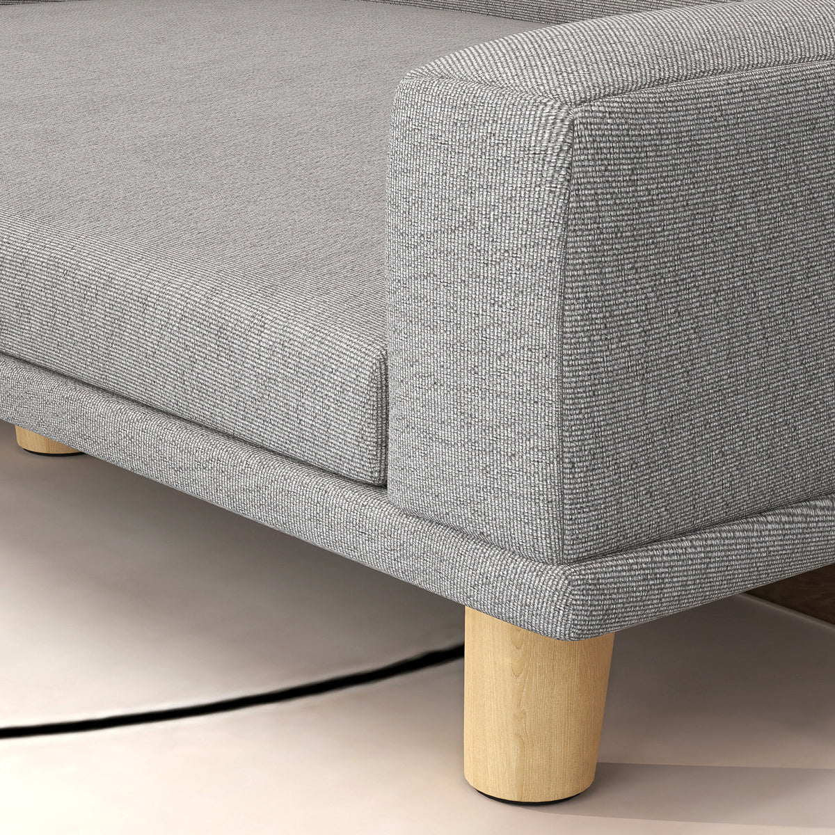 Close-up of the removable grey cushion on the elevated dog sofa