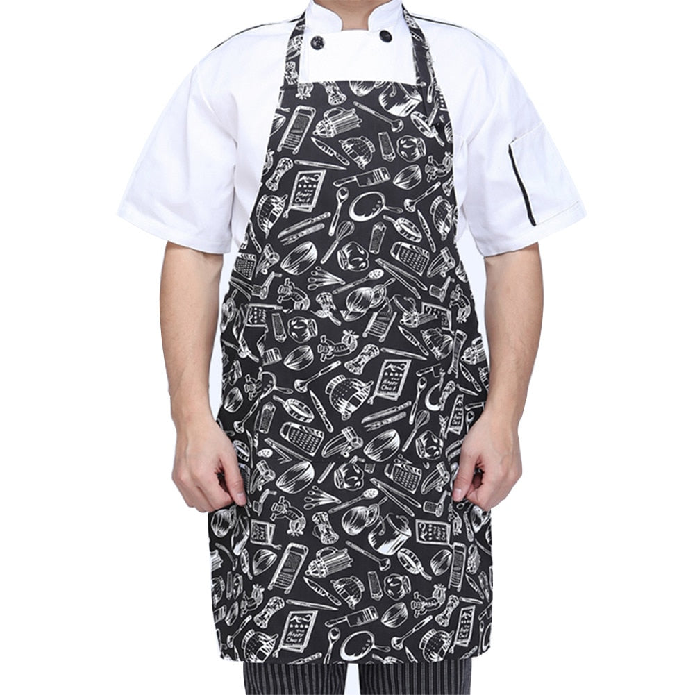 Tableware print halter neck apron in black with white cutlery motifs