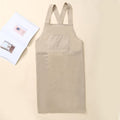 Beige Korean style kitchen apron with cross-back straps shown flat