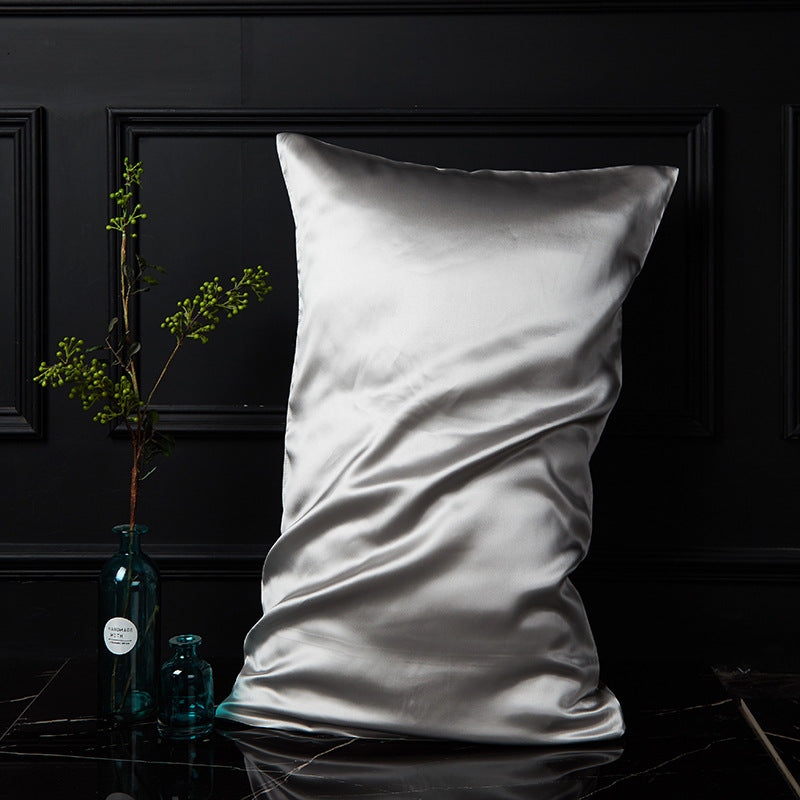 Moonlight silver mulberry silk envelope pillowcase reflecting soft light on black marble