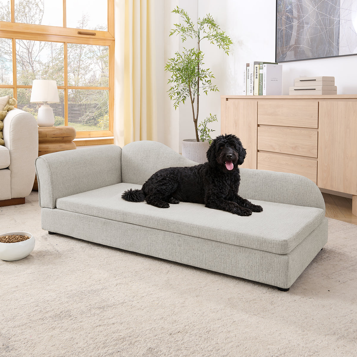 Dog lounging across the wave-backed beige linen pet sofa