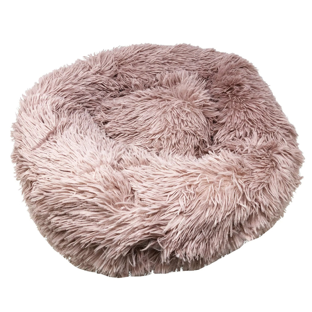 Angled view of the pink plush round dog bed showing its depth