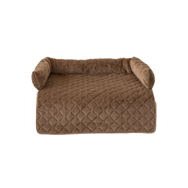 Coffee brown sofa-style dog bed with bolster back on plain background